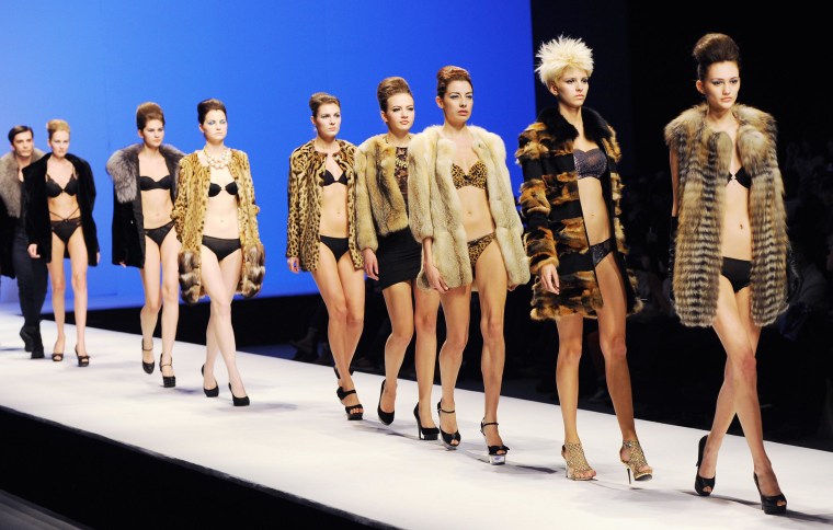 Models parade on the catwalk during Beijing's Fashion Week in 2012.