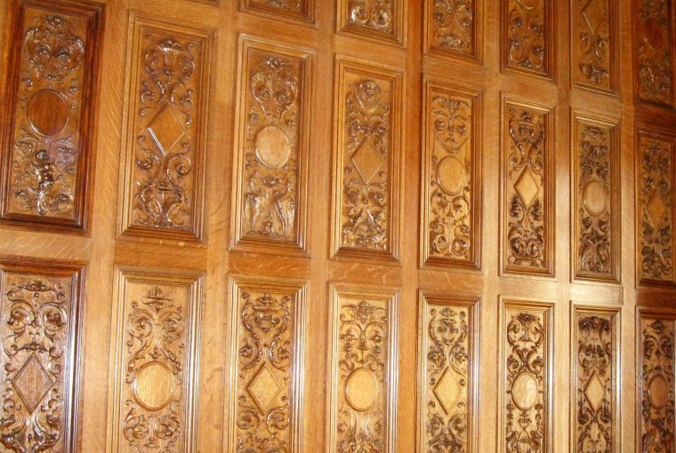 Image: hand-carved wood paneling in the dining room