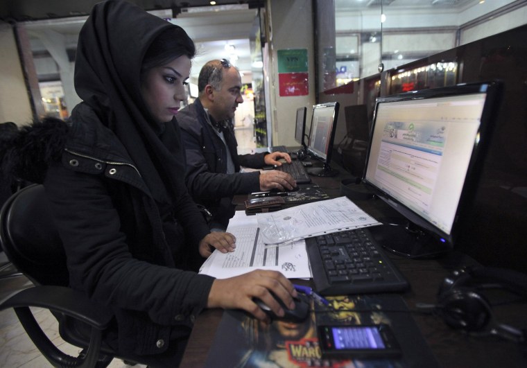 Image: Iranians surf the web in an internet cafe at a shopping center, in central Tehran.