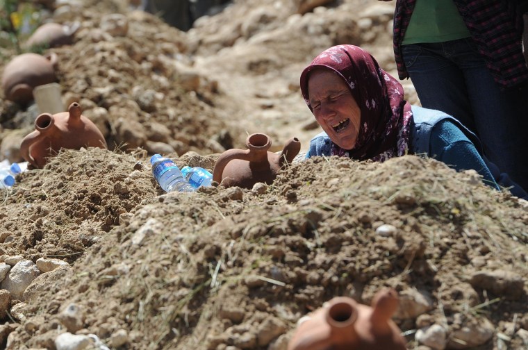 Image: A woman cries at the grave of a mine accident victim in Soma, Turkey, Thursday, May 15, 2014.
