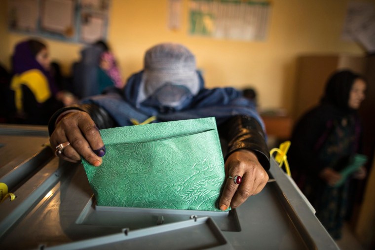 Image: An Afghan woman casts her ballot