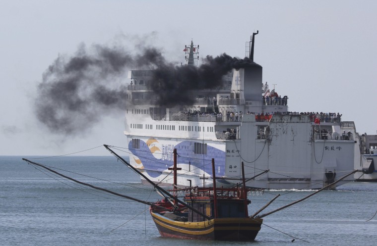 Image: A ship carrying Chinese workers leaves Vung Ang por