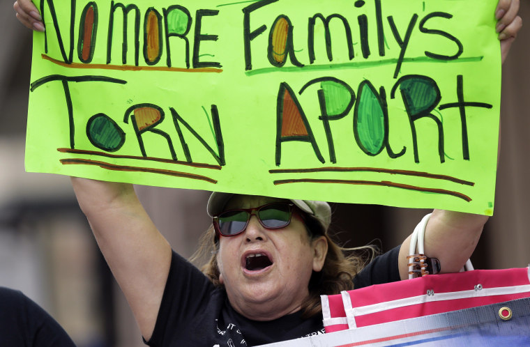 Supporters of immigration reform protest outside as House Speaker John Boehner addresses the San Antonio Chamber of Commerce, Monday, May 12, 2014, in San Antonio. 