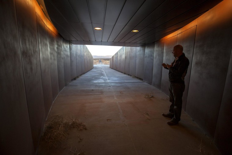 Image: Virgin Galactic's Mark Butler shows off the entrance to the Gateway to Space building where future astronauts will begin their suborbital experience.
