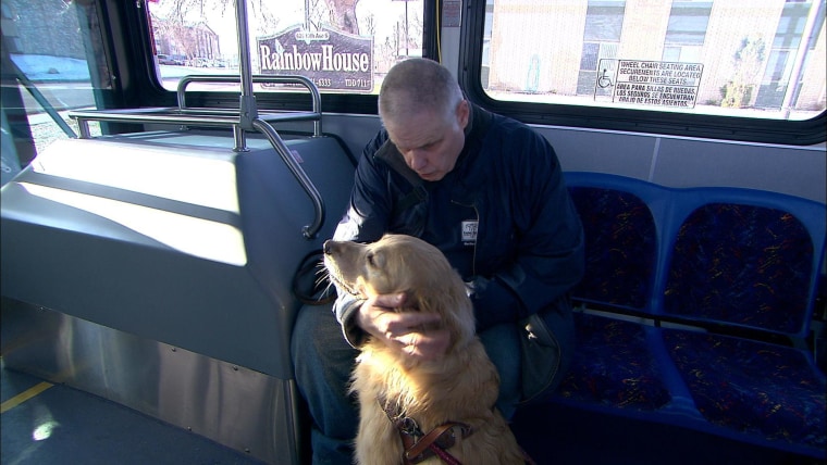 Harold Leigland with his guide dog on the way to work in Great Falls, Montana. The car service Uber is being probed in San Francisco over claims its drivers refuse to take service animals.