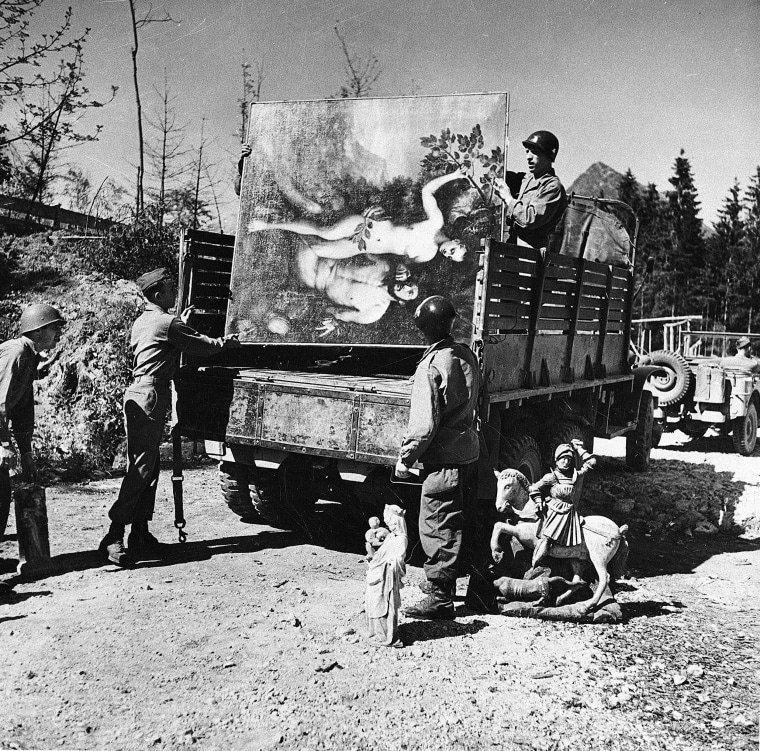 Image: Unidentified military personnel unload some of the art treasures recovered from Herman Goering's cave 