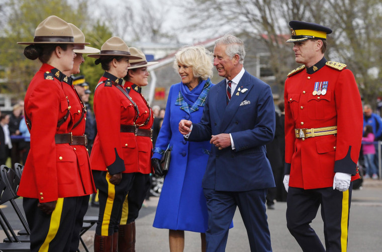 Image: Britain's Prince Charles and his wife Camilla, Duchess of Cornwall are greeted by Royal Canadian Mounted Police in Pictou, Nova Scotia