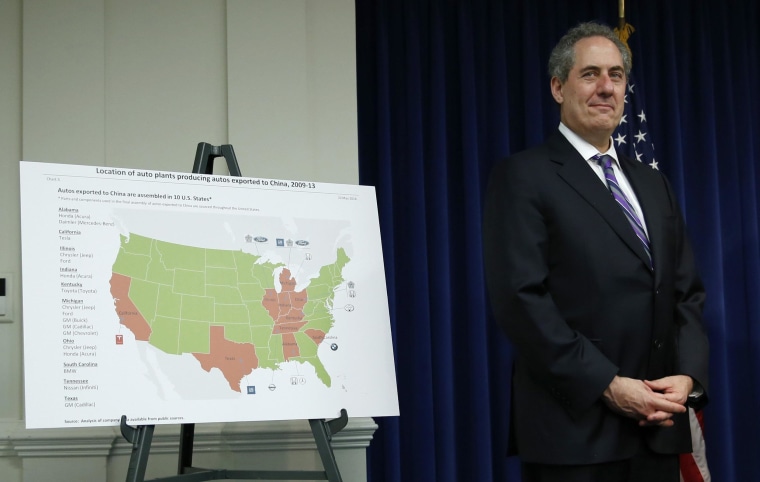 U.S. Trade Representative Michael Froman stands beside a map showing U.S. auto plants that export to China. The WTO ruled in favor of Washington in a trade dispute over Chinese duties on imports.