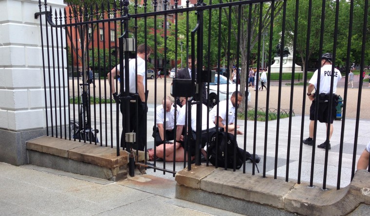Image: A man stripped naked in front of the White House on Friday afternoon, but was quickly covered up and subdued by officers, according to the Secret Service.