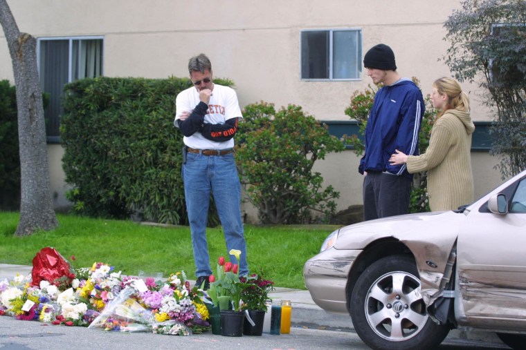Image: In this Feb. 25, 2011 file photo, Residents of Isla Vista and University of California, Santa Barbara, look at a memorial on the street