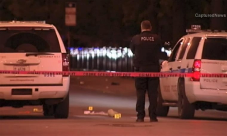 Image: Police investigate the scene of a shooting in Chicago on Saturday.