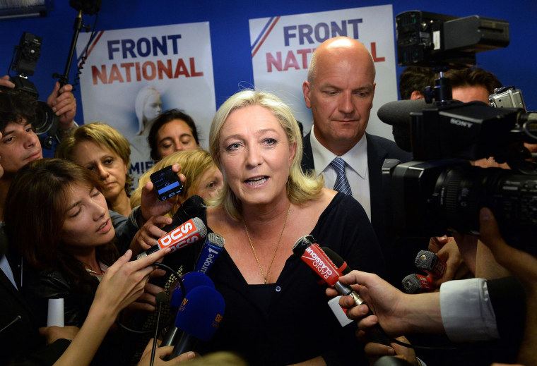 Image: French far-right Front National (FN) party president Marine Le Pen reacts at the party's headquarters