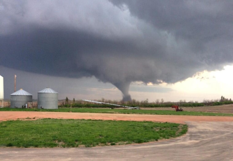 Image: A tornado barrels through Watford City, N.D., on Monday, May 26.