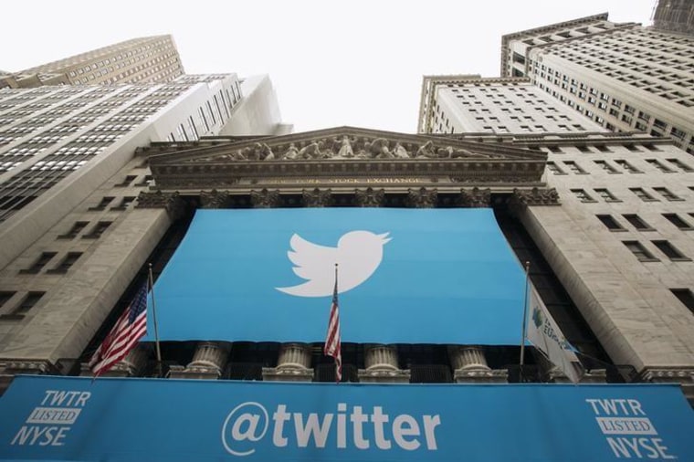 Image: A sign displays the Twitter logo on the front of the New York Stock Exchange