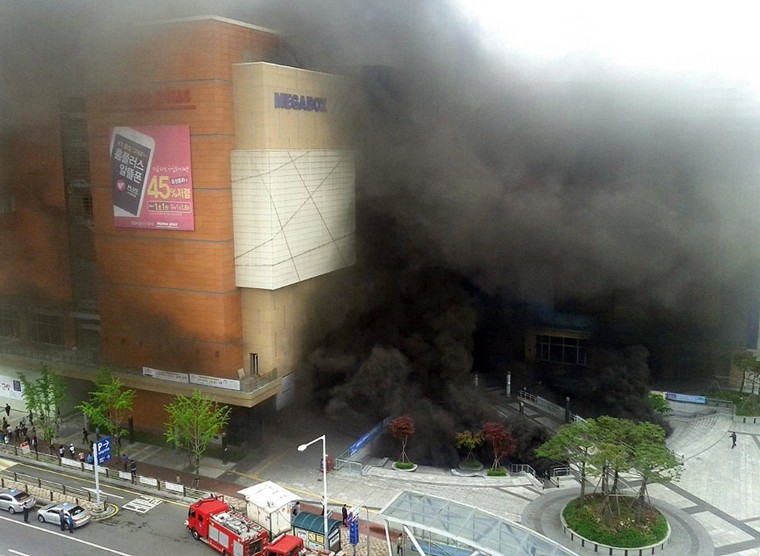 Image: Smoke rises after a broke out at a bus terminal and shopping mall complex in Goyang