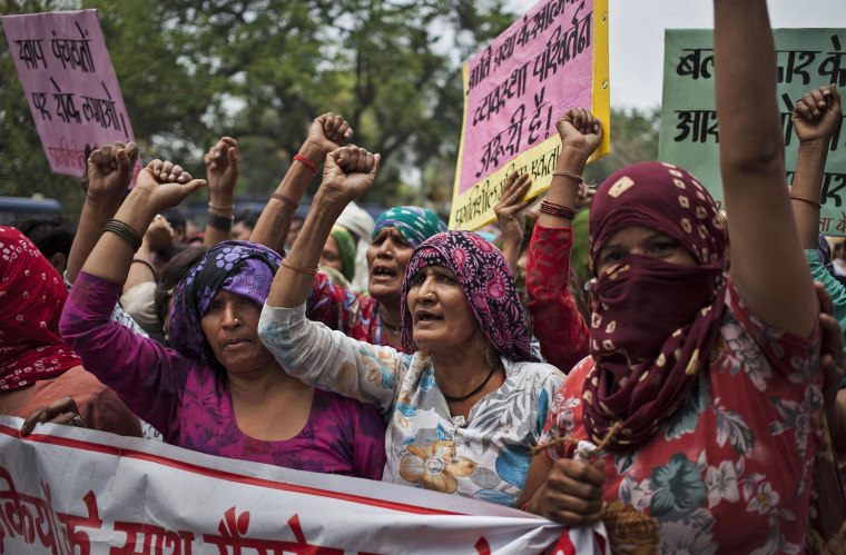 Image: Indian Dalit women shout slogans during a protest against a gang-rape of four Dalit girls