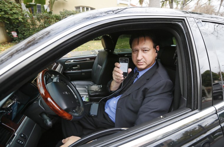 Transportation app Uber driver Shuki Zanna waits for customers in his limousine in Beverly Hills