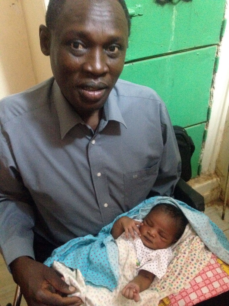 Image: Daniel Wani with newborn daughter Maya