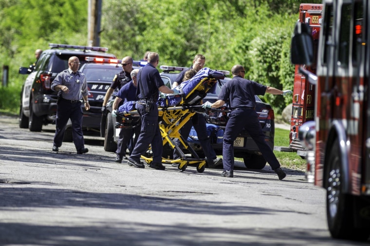 Image: Rescue workers take a stabbing victim to the ambulance in Waukesha, Wis., on May 31