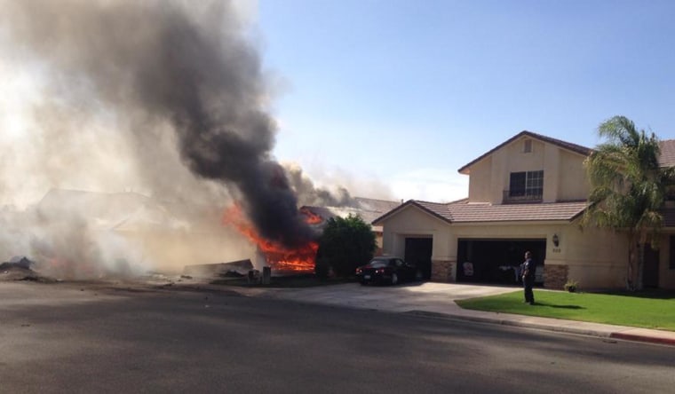 Image: A plane crash set a building on fire in Imperial, Calif., on June 4.