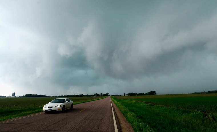Image: A car heads east on 85th Street near Harrisburg, S.D.