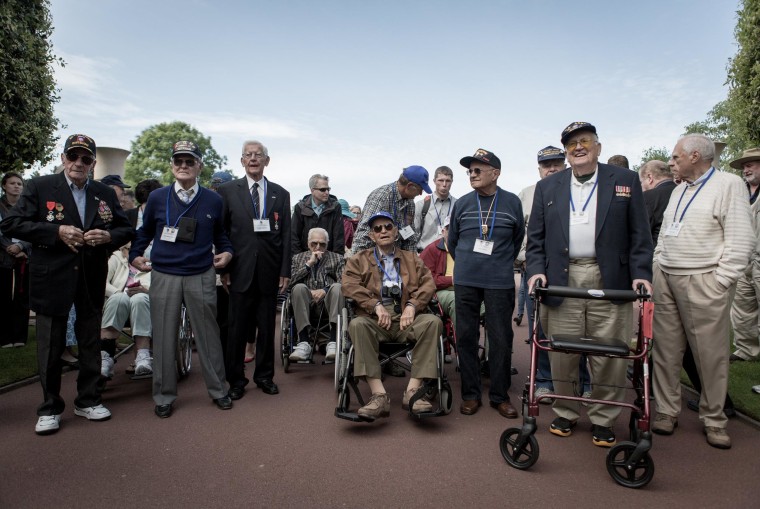 Image: U.S veterans arrived at the U.S. cemetery in Collville, Normandy on Thursday.