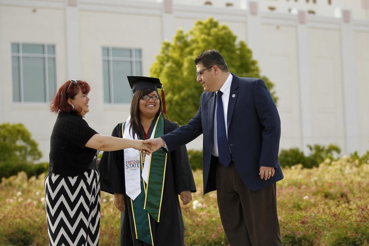 Fresno State president Joseph I. Castro greets Patricia Reyes. Patricia’s daughter Maria Ortega is a first-generation college graduate, and will now go on to a PhD program at Brown University. President Castro was also the first in his family to graduate from college; his grandparents were farm workers who immigrated from Mexico.