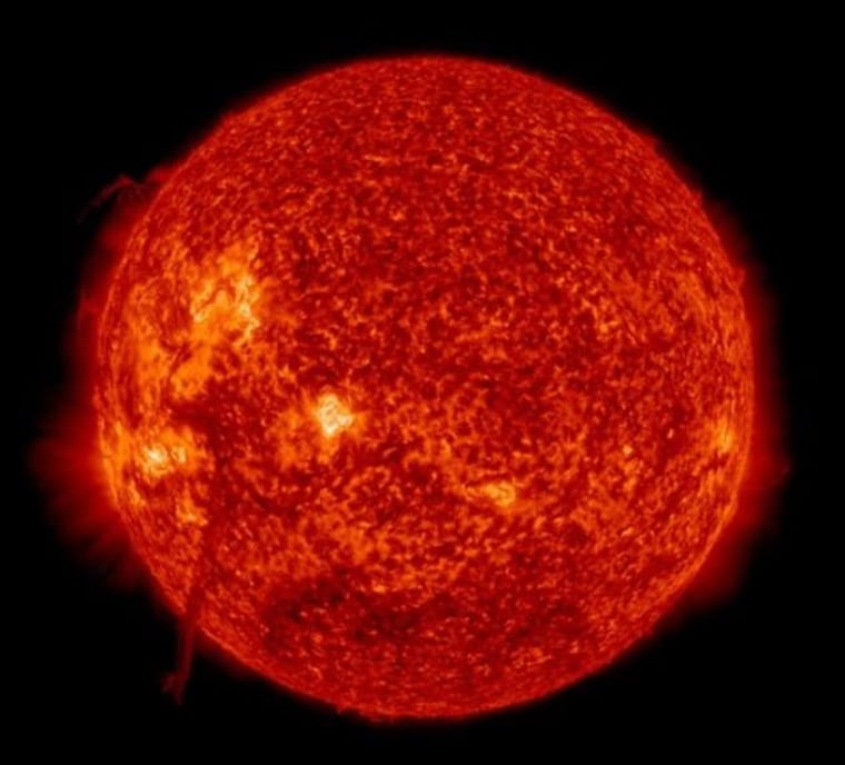 A giant plasma filament can be seen rising up off the sun's surface at lower left in this full-disk view from NASA's Solar Dynamics Observatory, captured June 4. The filament triggered a solar eruption known as a coronal mass ejection.