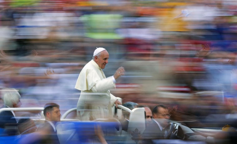 Image: Pope Francis waves as he leads a special audience in Saint Peter's Square at the Vatican