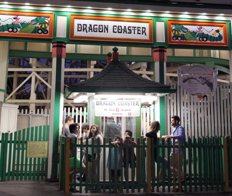 Image: People wait on line to ride the Dragon Coaster at Playland amusement park in Rye, N.Y.