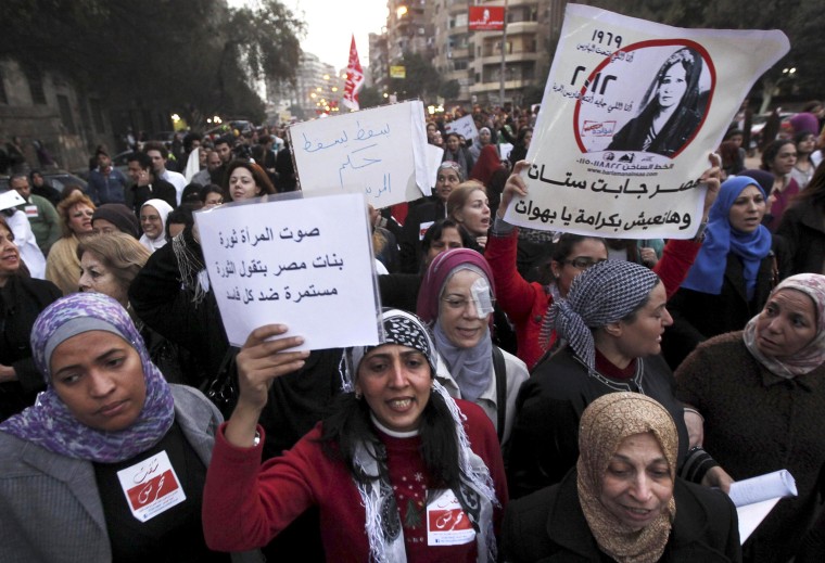 Image: Women shout solgan against Egyptian President Mursi and members of Brotherhood's during march and a protest against sexual harassment and violence against women in Cairo