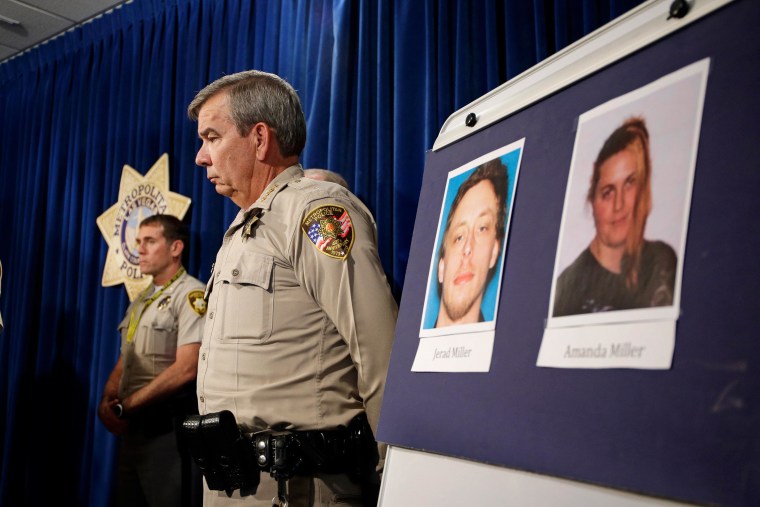 Image: Las Vegas Sheriff Doug Gillespie stands by a board with the pictures of suspects Jerad Miller and Amanda Miller during a news conference