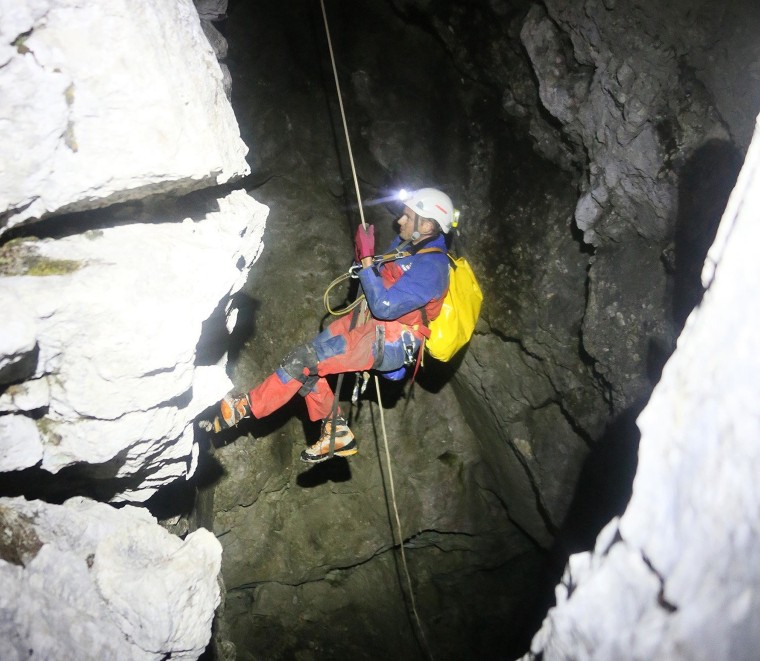 Image: A rescuer enters a cave near Berchtesgaden, Germany