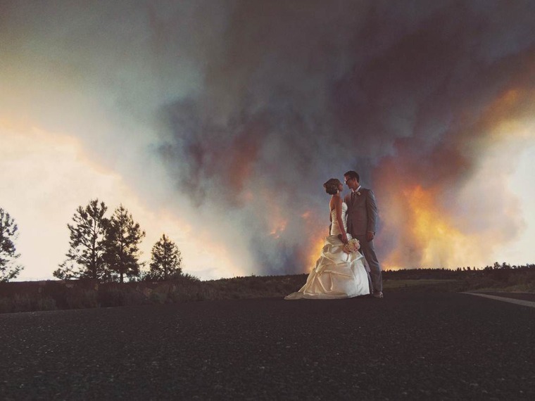 Image: In this Saturday, June 7, 2014 photo provided by Josh Newton, newlyweds Michael Wolber and April Hartley pose for a picture near Bend, Ore