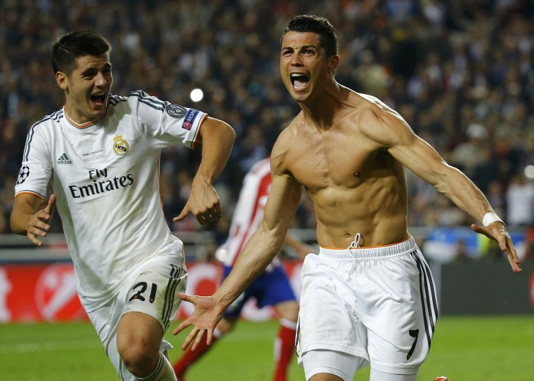 Image: Real Madrid's Ronaldo celebrates with team mate Morata after scoring a penalty against Atletico Madrid during their Champions League final soccer match at the Luz Stadium in Lisbon
