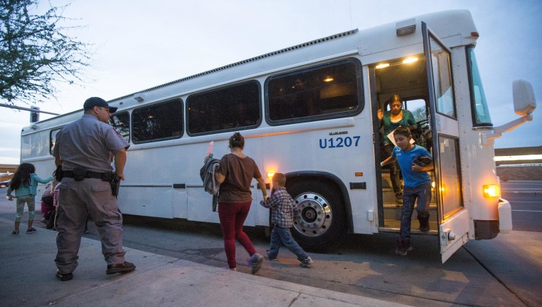 Image: Migrants are released from ICE custody at a Greyhound Bus station in Phoenix, May 28