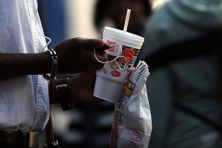 Image: A teen drinks a large soda on Oct. 17, 2013 in the Brooklyn borough of New York City.