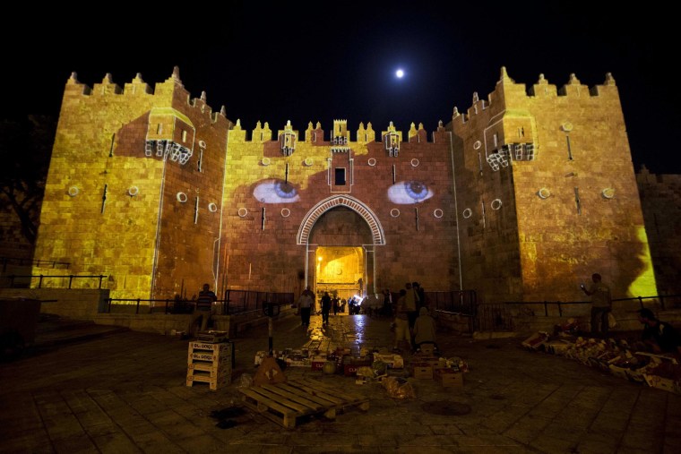 Image: A light projection show is seen on the Damascus Gate