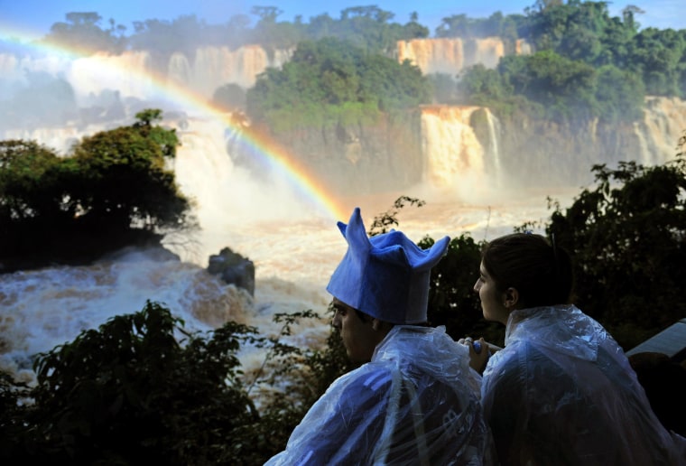 Image: Tourists enjoy Iguacu Falls on June 12, 2014, in Foz do Iguacu, Brazil.