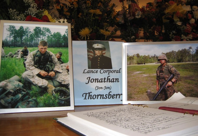Image: Photos of Marine Lance Cpl. Jonathan Thornsberry at his funeral in 2006.