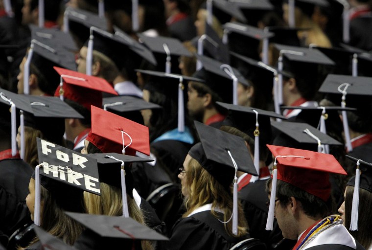 Image: Students attend graduation.