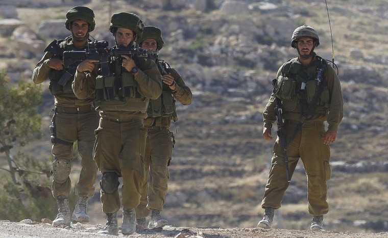 Image: Israeli soldiers patrol near Hebron