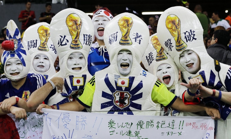 Image: Japanese supporters react before the start of  the group C World Cup soccer match between Ivory Coast and Japan at the Arena Pernambuco in Recife, Brazil