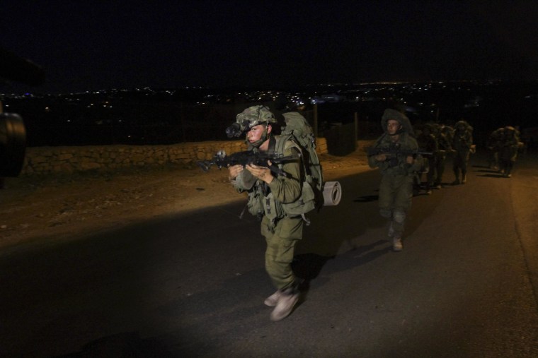Image: Israeli soldiers patrol during the search Sunday for three missing teenagers