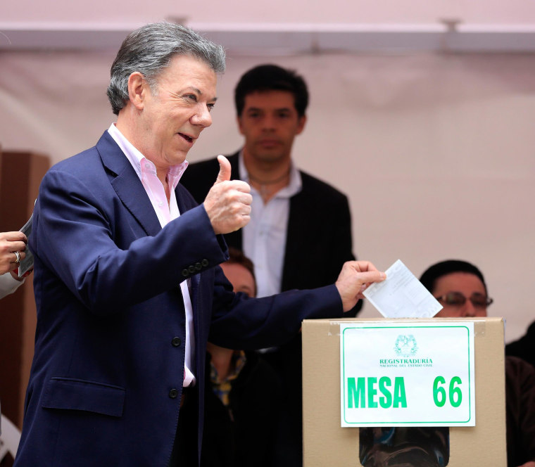 Image: President Juan Manuel Santos casts his vote in Bogota