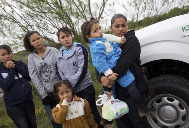 Image: U.S. Border Patrol agents detain a group of young migrants from Honduras and Guatemala