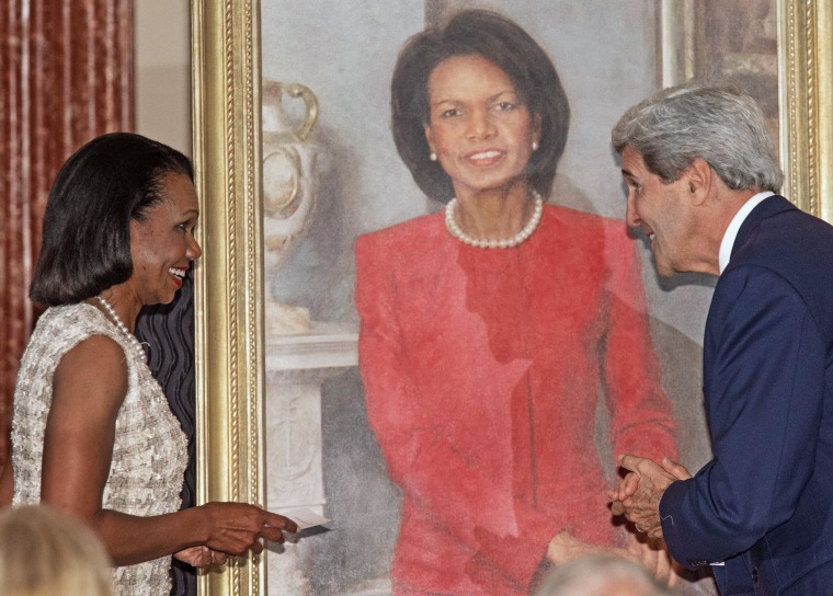 Image: Secretary of State John Kerry smiles with former US Secretary of State Condoleezza Rice