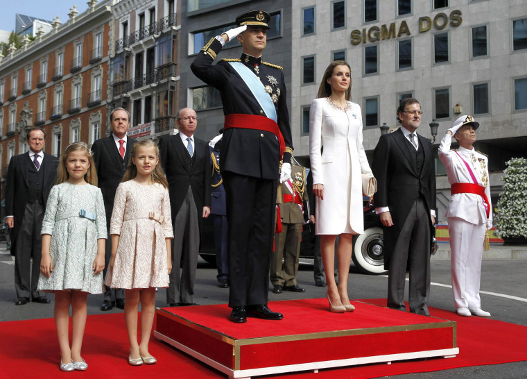 Image: Princess Sofia, Princess Leonor of Asturias, King Felipe VI of Spain, Queen Letizia of Spain, Prime Minister Mariano Rajoy and General Admiral Fernando García Sanchez watch a parade of Civil Guard at the Congress of Deputies prior to the King's off