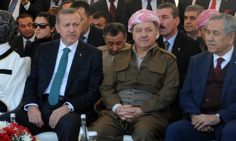 Image: Turkish Prime Minister Recep Tayyip Erdogan, left, and Iraqi Kurdish leader Massud Barzani, second right, attend a meeting on Nov. 16, 2013, in Diyarbakir, Turkey.