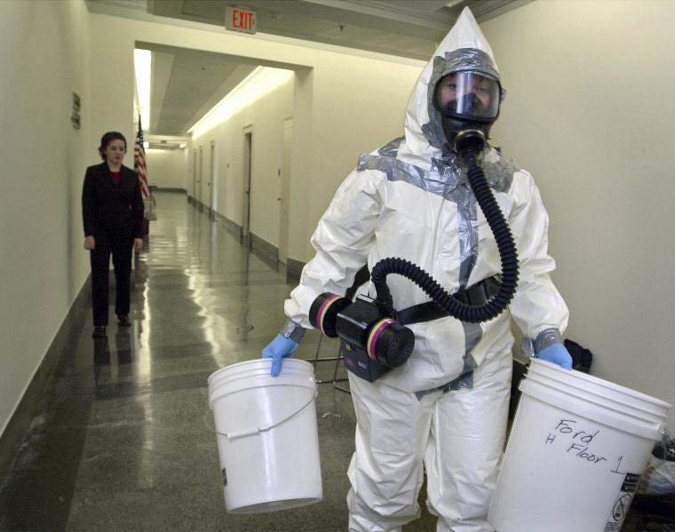 A biohazard worker prepares to enter the office of Rep. Mike Pence, R-Ind., in the Longworth House office building on Capitol Hill  in Washington in 2001.